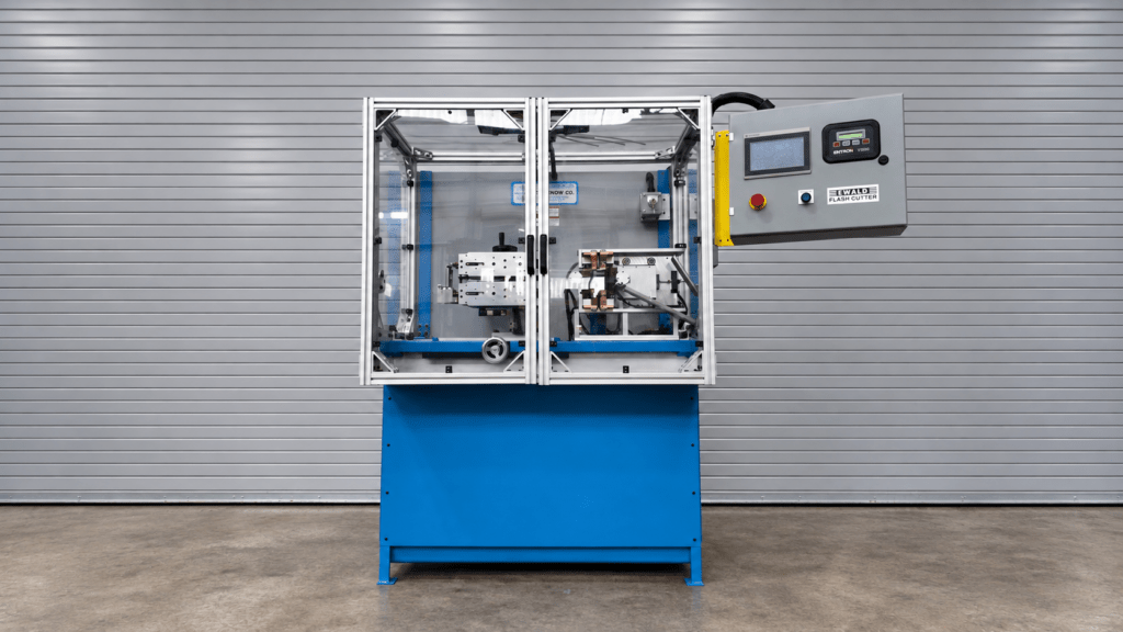 Ewald Flash Cutter machine in front of door